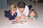 Dad reading to kids